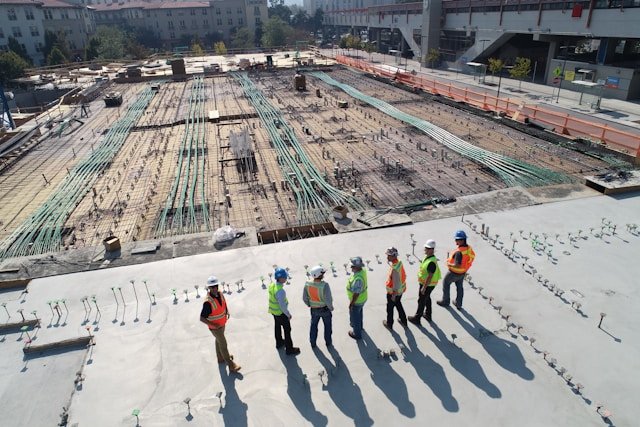 A couple of workers on a construction site discussing how to generate construction leads