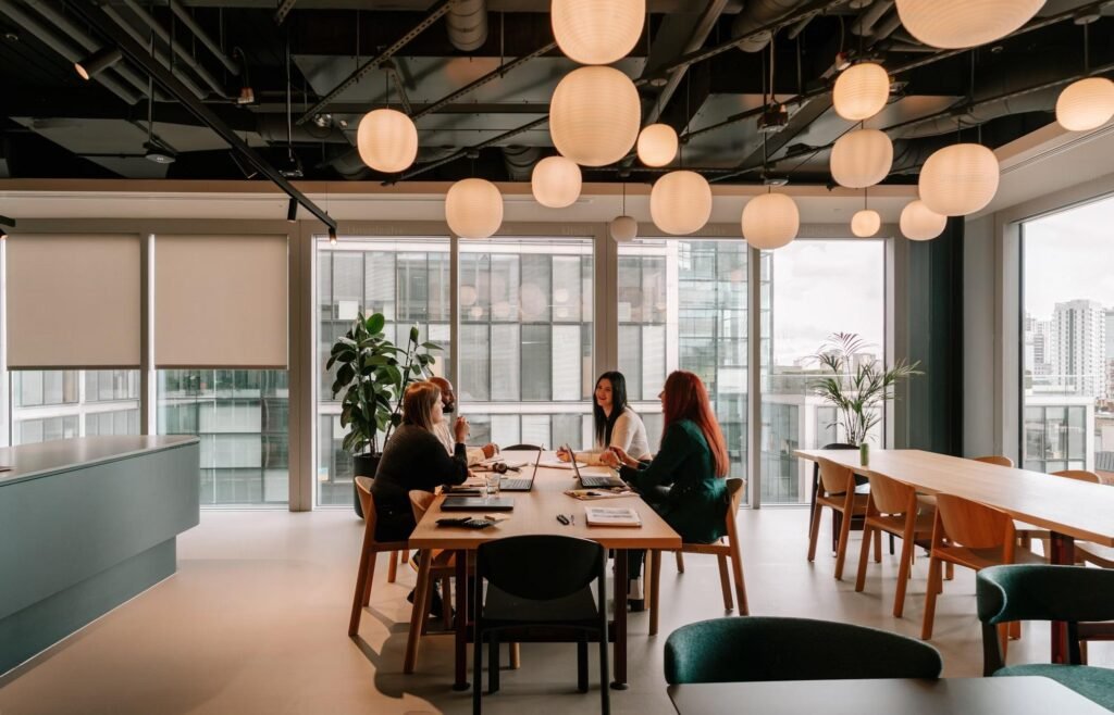 People discussing fintech lead generation at a desk table in an office